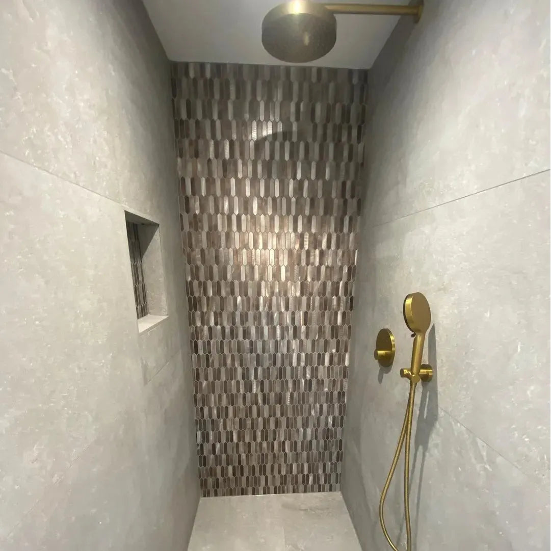 Odyssey Amber Metal Mosaic gold metal mosaic with a showerhead and handheld sprayer