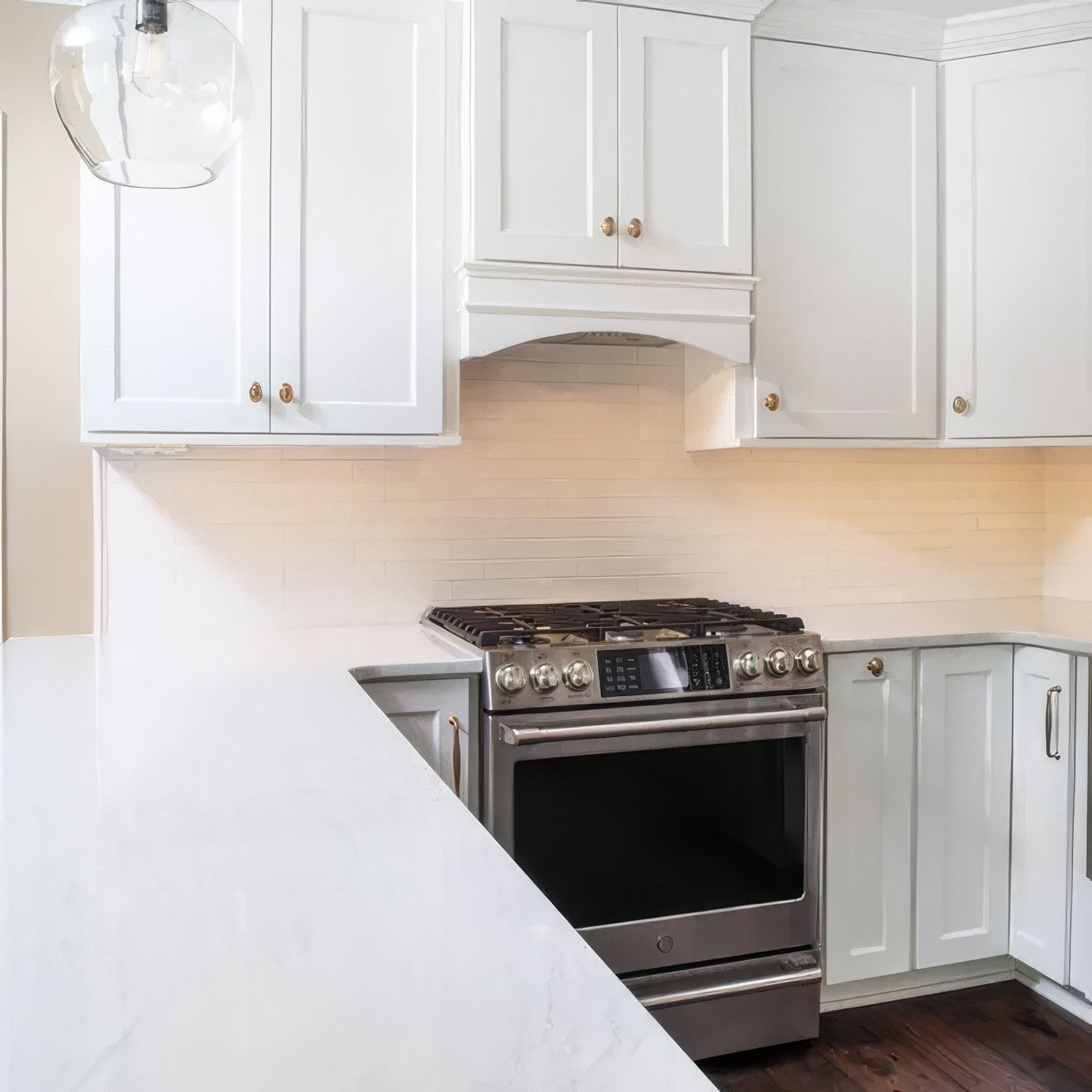 Onda Artic Wall Tiles white subway tiles with a stainless steel gas range