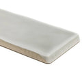 A sleek rectangular white ceramic onda chamelon wall tile with a smooth glossy finish and rounded edges