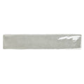 A sleek rectangular ceramic onda chamelon wall tile with matte gray finish and subtle glossy edge highlights