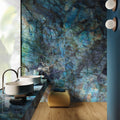 The wall is adorned with a large polished onyx sapphire panel in blue and green with natural veining patterns