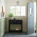 Orford Buckingham sleek black console table with four drawers metal handles and a lower shelf for storage and display