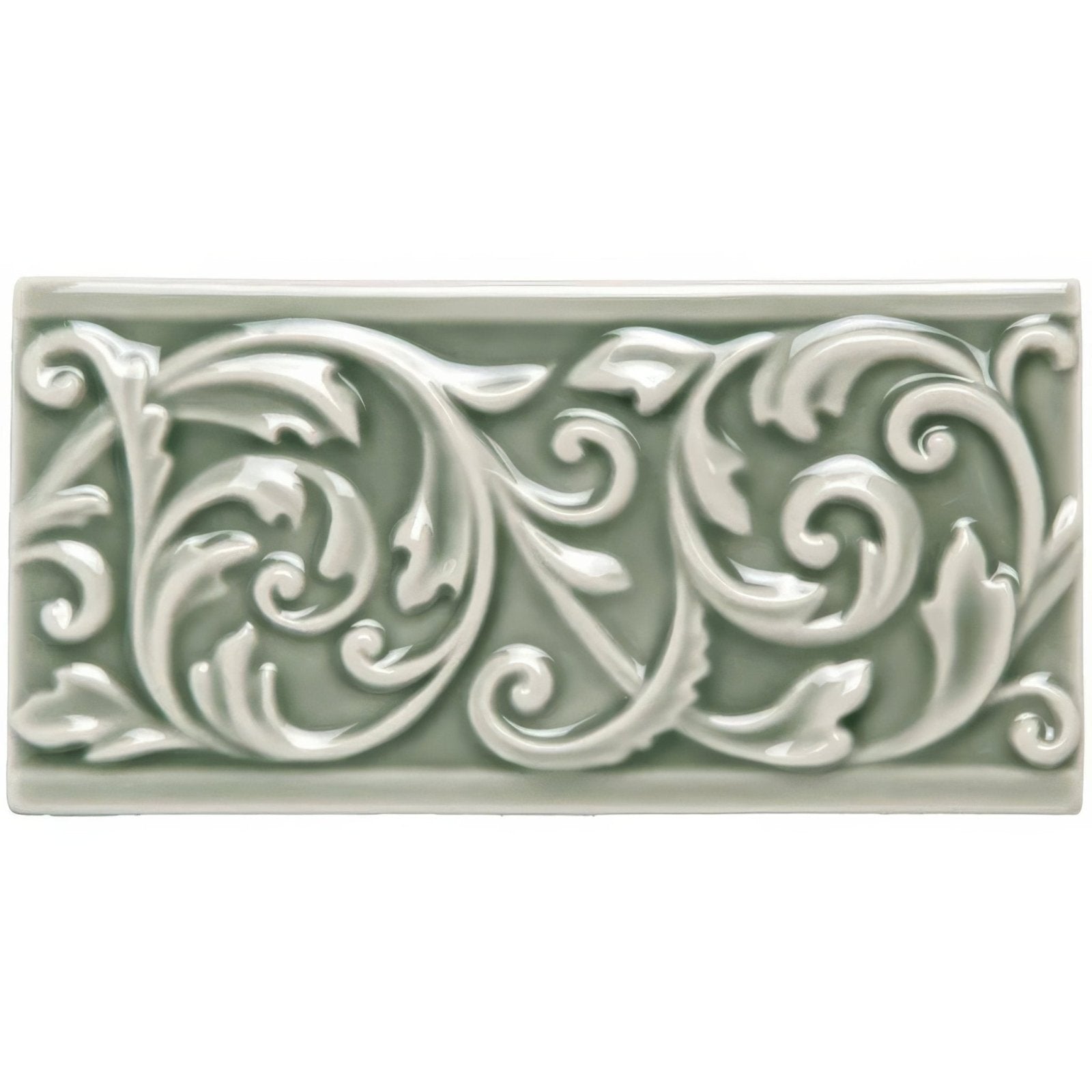 A rectangular ceramic Orford Buckingham tile with raised scrollwork design in matte sage green glaze