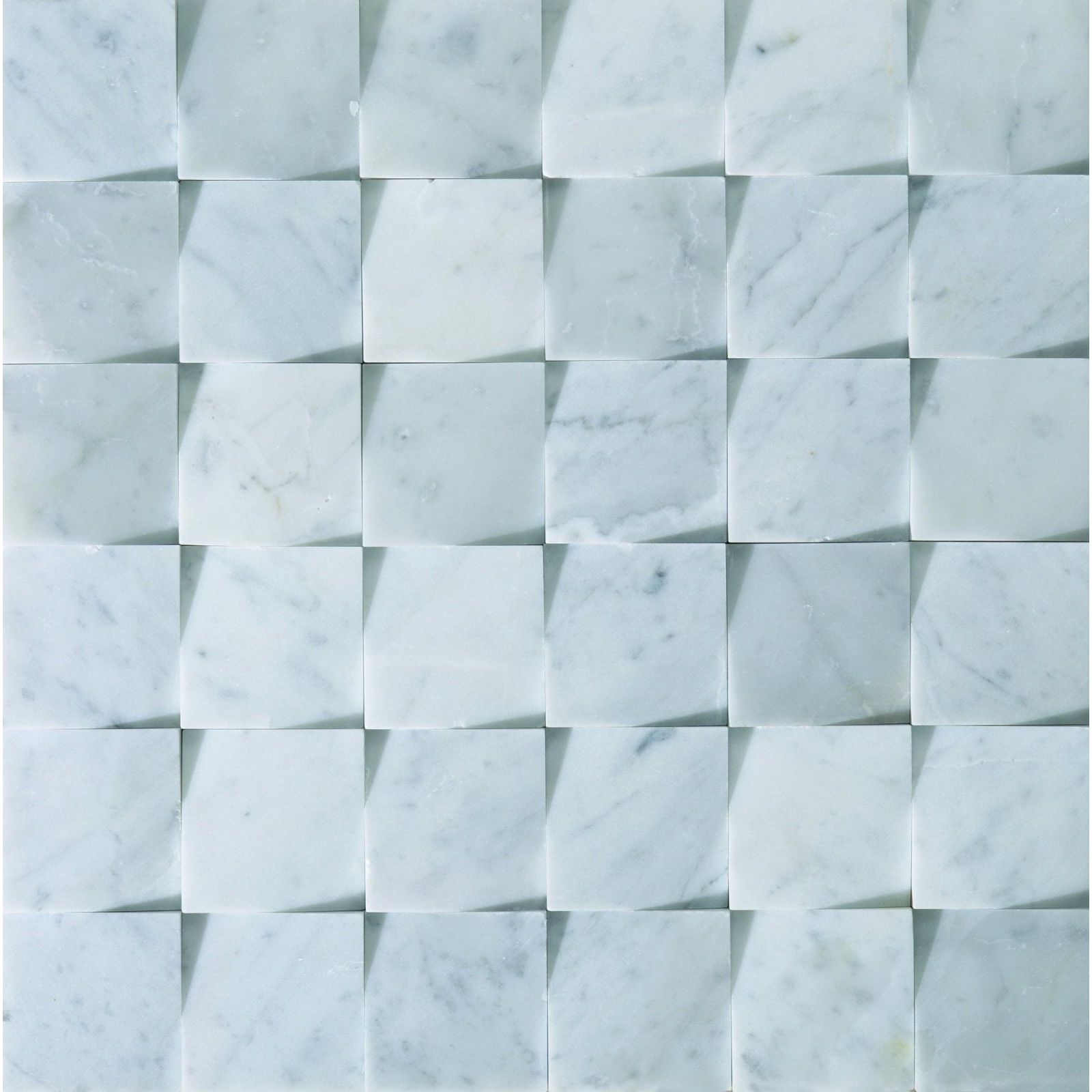 White marble mosaic tiles with subtle gray veining in a three dimensional interlocking pattern origin grey stone mosaic