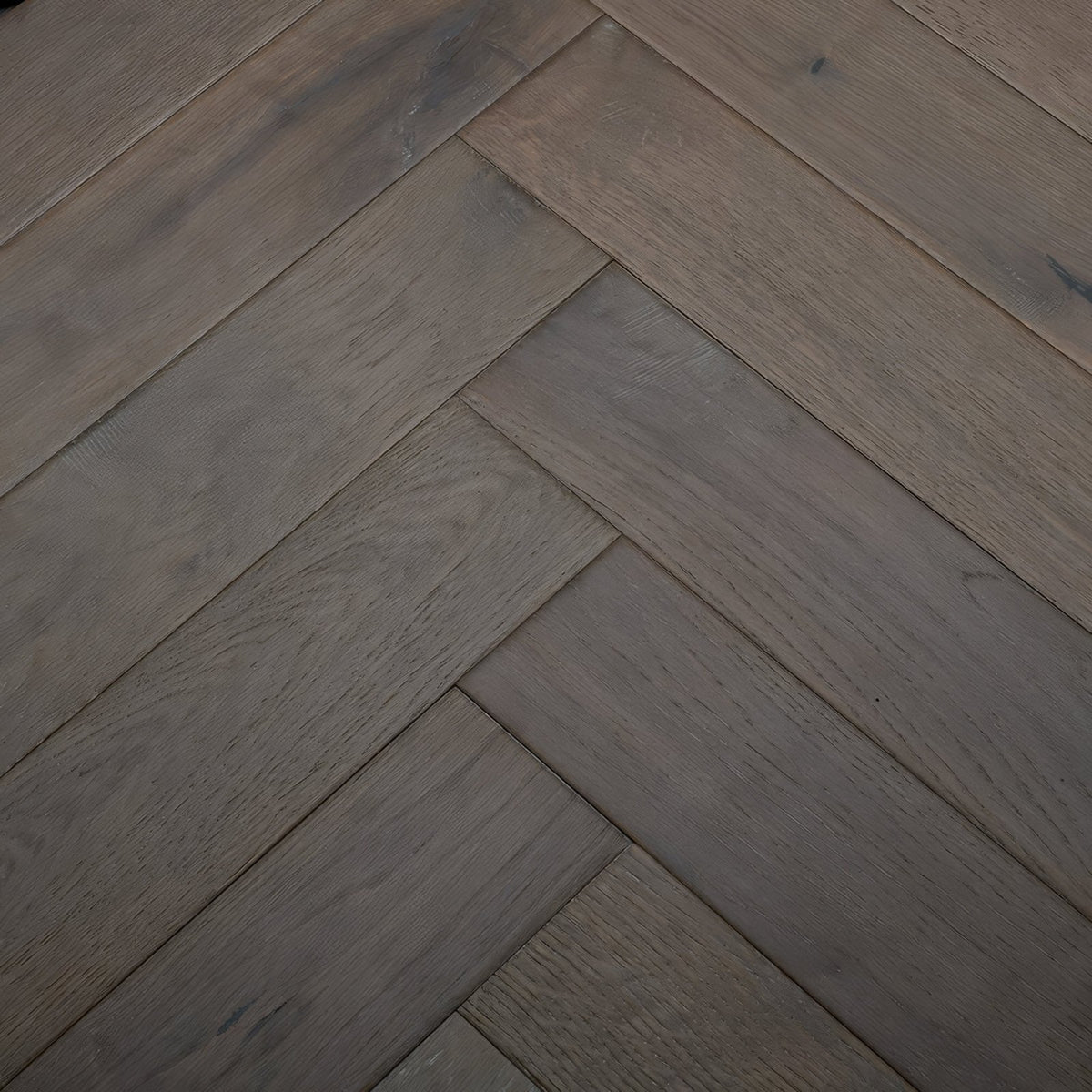 Dark gray herringbone pattern hardwood flooring in orkney truffle oak for modern interior spaces