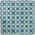 A square ceramic tile called ormeaux blue on mint featuring a repeating blue cross geometric pattern on white background