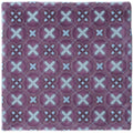 Purple ceramic tile ormeaux on glen with repeating geometric pattern of light blue x-shapes and diamond accents