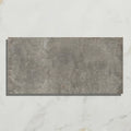 Gray rectangular textured porcelain tile with stone-like surface from osterley porcelain black brick collection