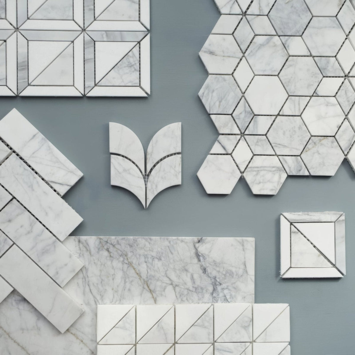 Ottimo marble 61 x 30.5cm white marble mosaic tiles with gray veining silver grout in geometric hexagon triangle and leaf patterns