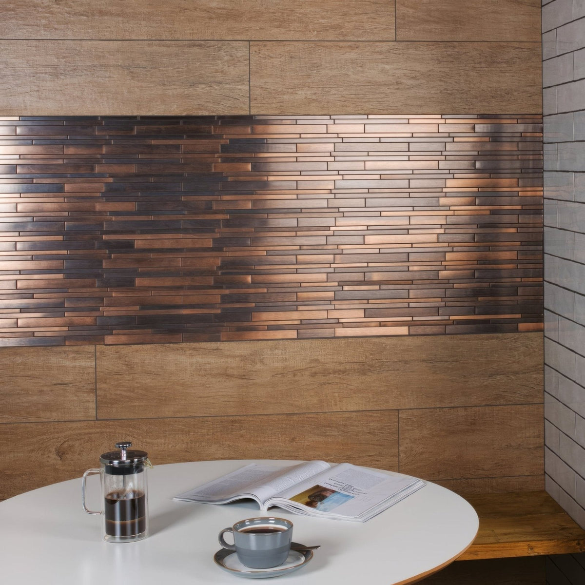 Copper-toned ottone metal mosaic with a rustic layered design in metallic brick-style wall panel form