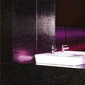 Pacha Glass Mosaic dark sparkling glass mosaic with a white sink and chrome taps