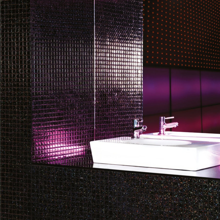 Pacha Glass Mosaic dark sparkling glass mosaic with a white sink and chrome taps