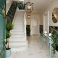 Palatina Gold Matt 60x60 Marble Effect Tile white marble-effect tiles on a staircase with ornate balusters