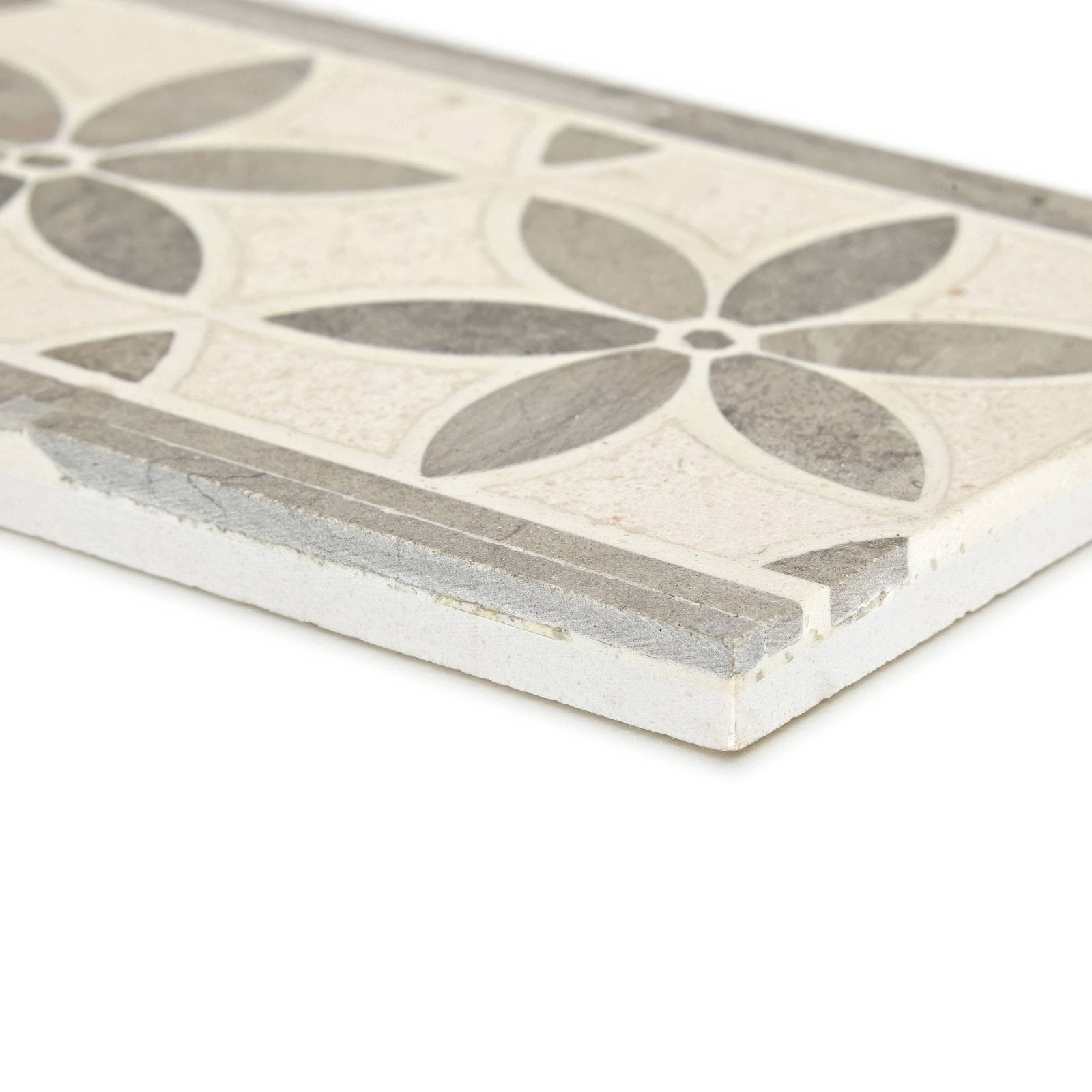 A rectangular palazzo corsini border ceramic tile with off-white base and intricate gray floral leaf pattern