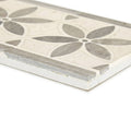 A rectangular palazzo corsini border ceramic tile with off-white base and intricate gray floral leaf pattern
