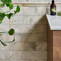 Palazzo Oro honed marble subway tiles 30.5 x 10cm with white color and subtle gray veining for elegant wall design