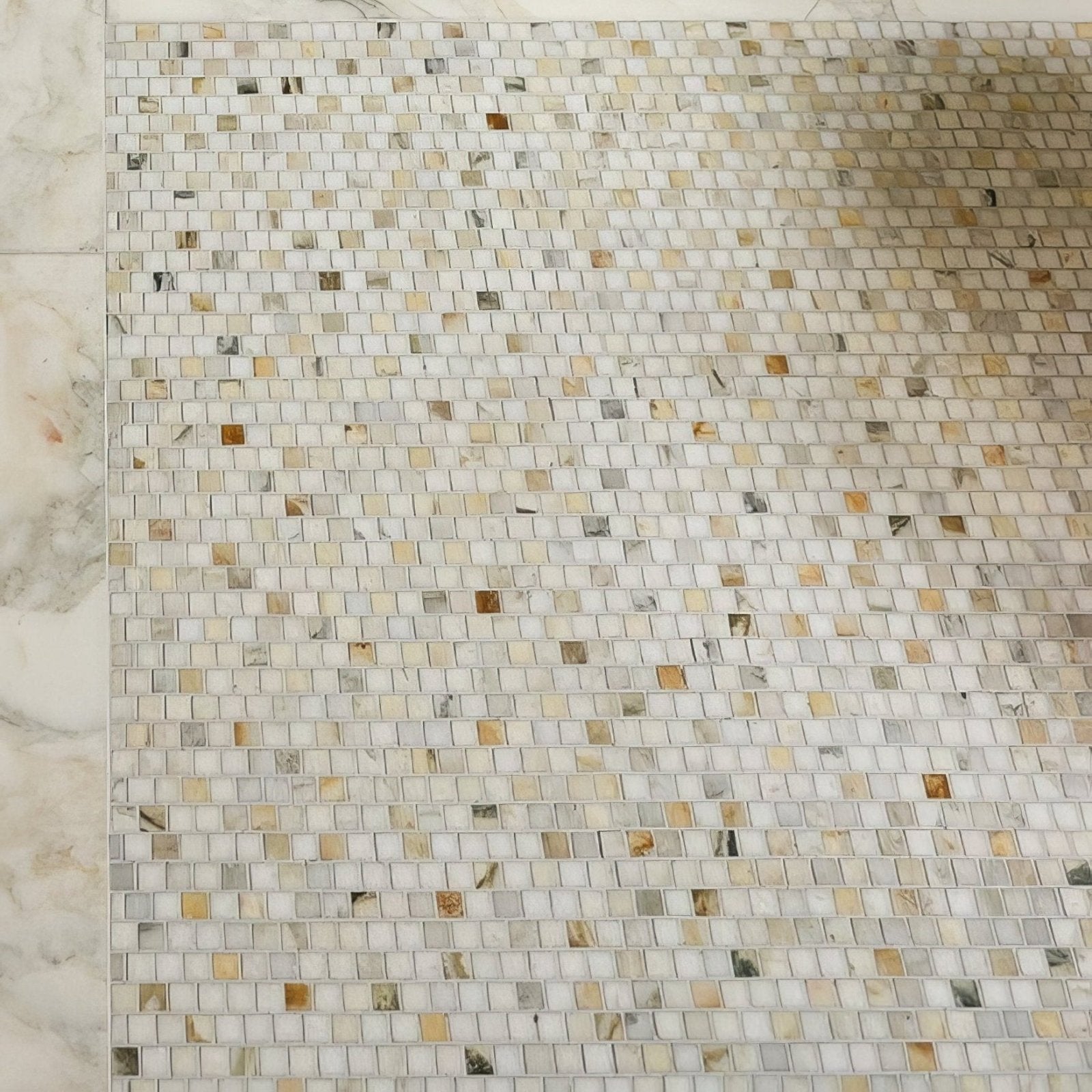 Palazzo oro marble brickbond square mosaic wall featuring small white beige and gray marble tiles with brown veining