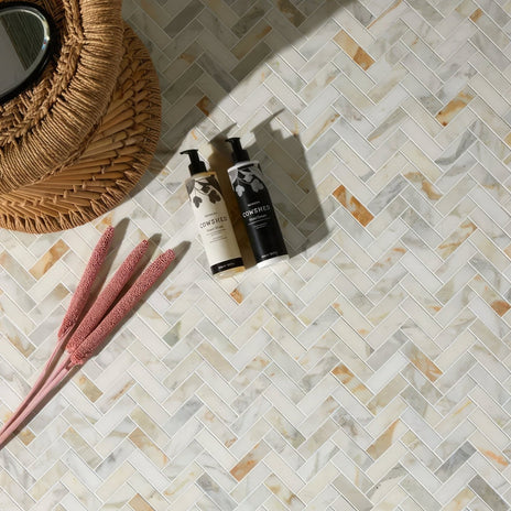 Palazzo Oro Marble Herringbone Mosaic white marble herringbone mosaic with two cowshed pump bottles