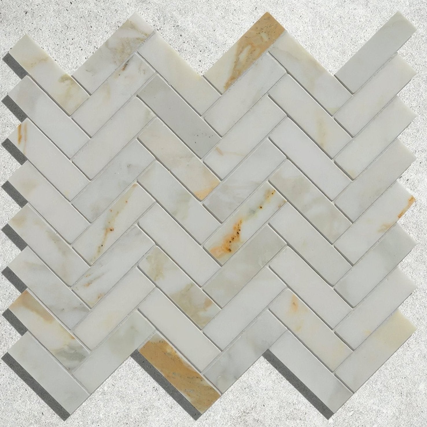 Palazzo oro marble herringbone mosaic featuring white marble tiles with subtle beige and gold veining in a herringbone pattern