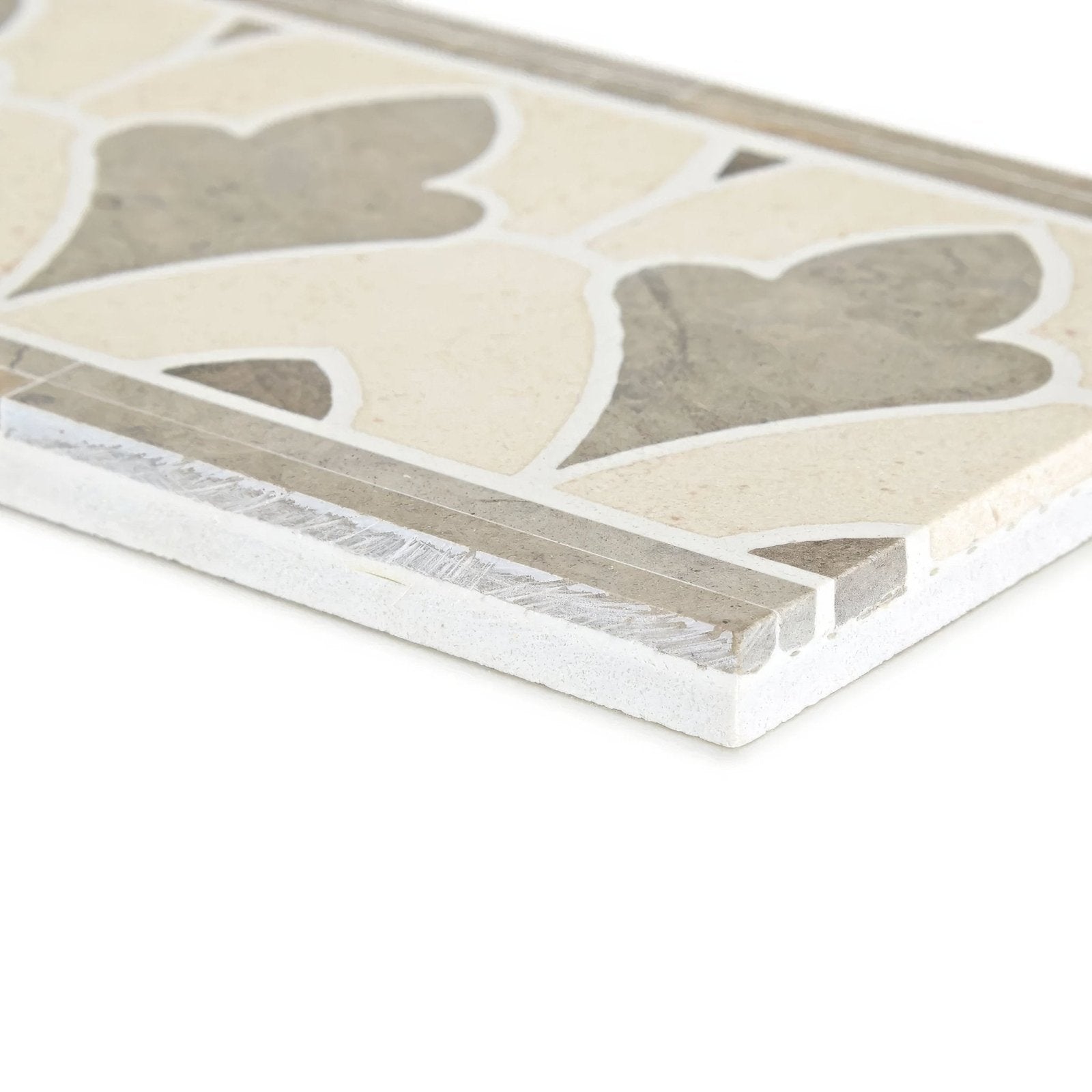 Beige and gray mosaic tile with decorative leaf pattern from palazzo valentini border for elegant wall or floor design
