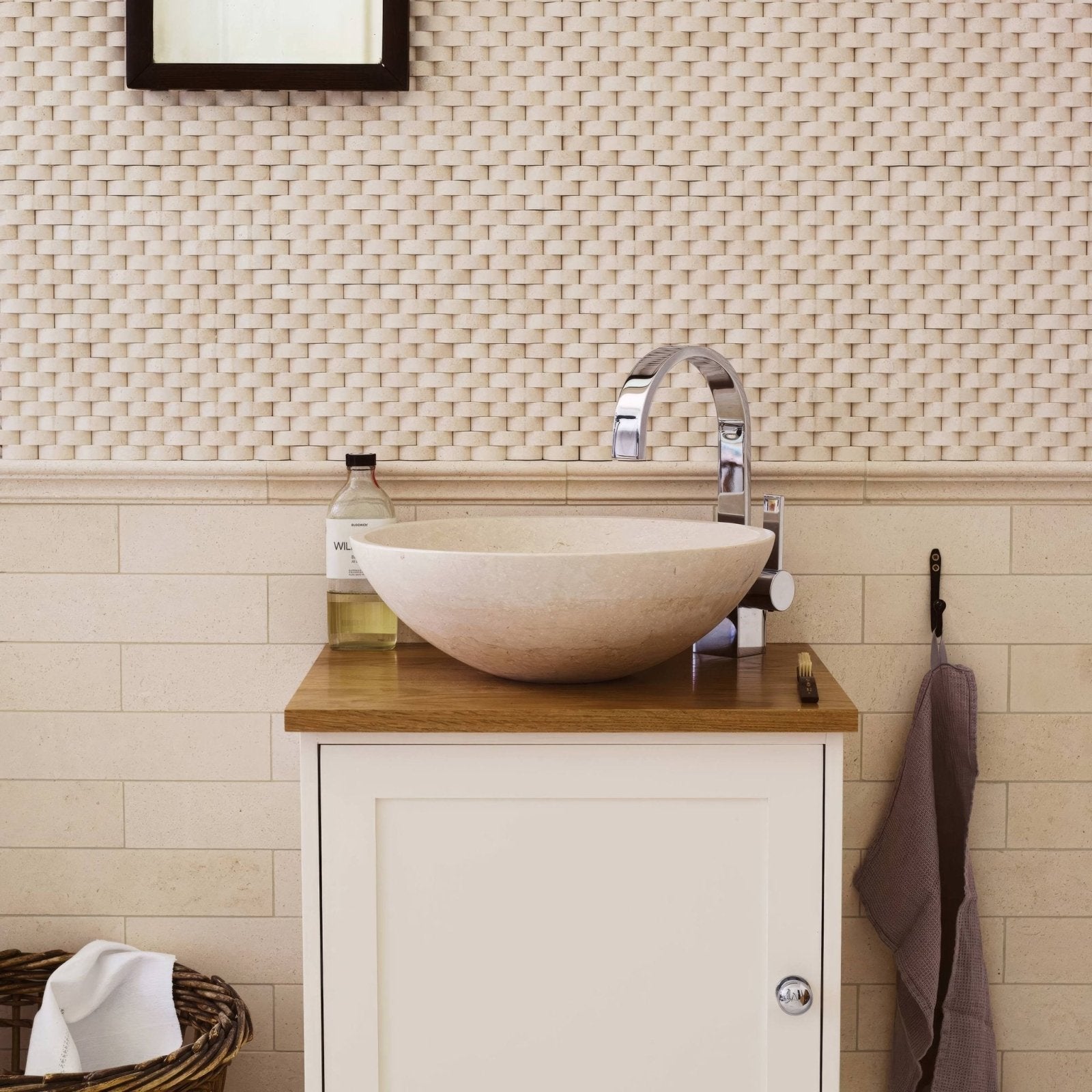 Beige stone vessel sink palio 7 x 30.5 diamond sawn edge honed with curved chrome faucet on wooden countertop