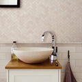 Palio Limestone Herringbone Mosaic Tile cream limestone herringbone mosaic with a cream stone vessel sink
