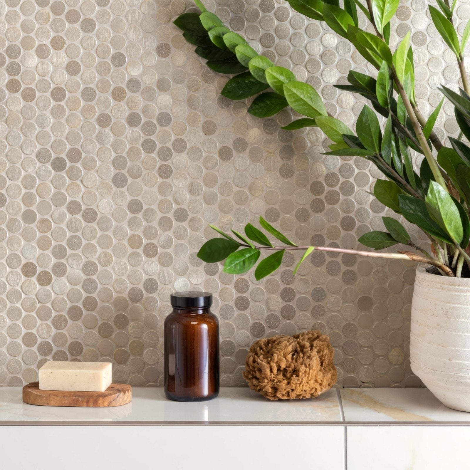 Pallene Gold Mixed Finish Penny Round gold penny round mosaic with a brown glass bottle