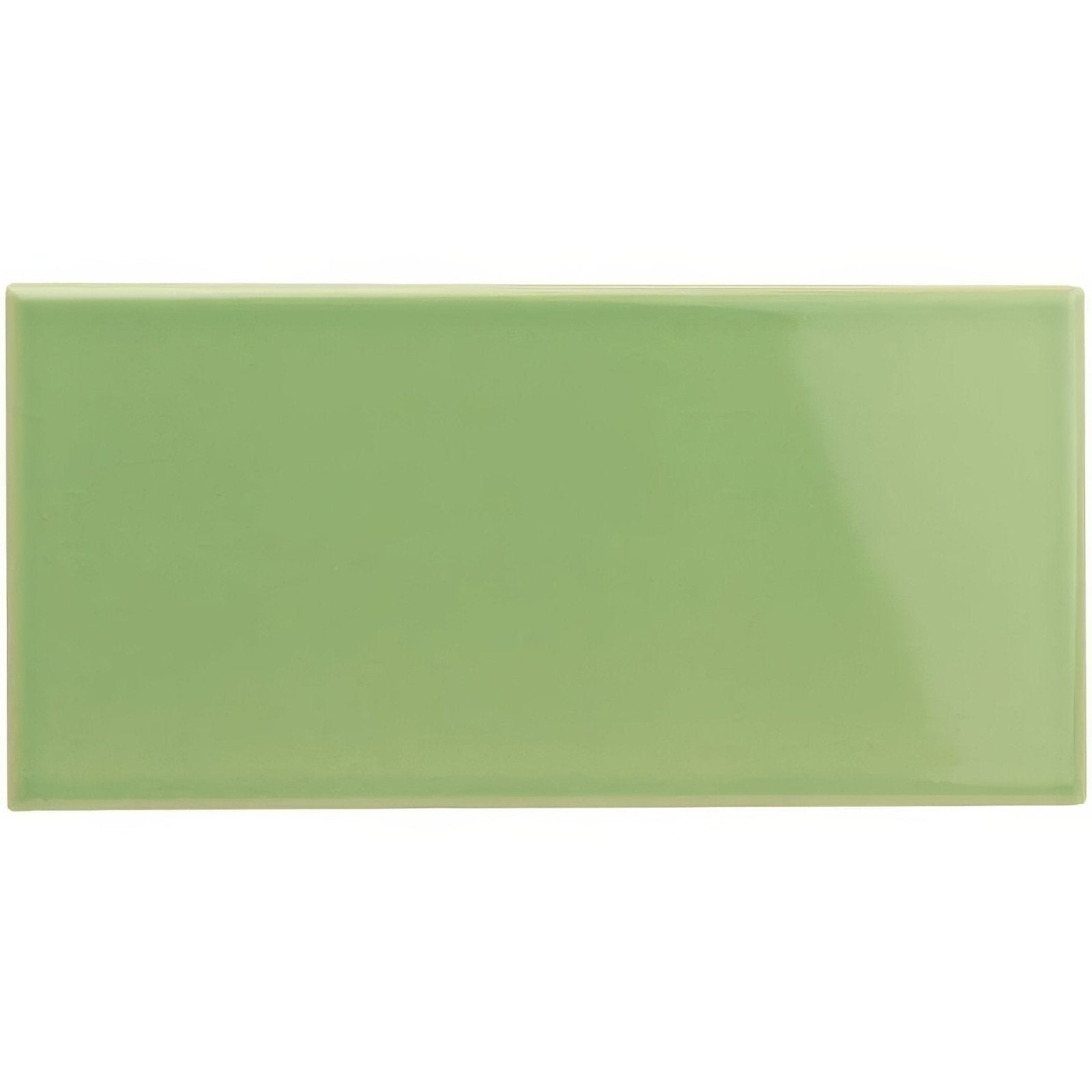 A smooth glossy sage green rectangular ceramic tile with subtle sheen called palm green half tile