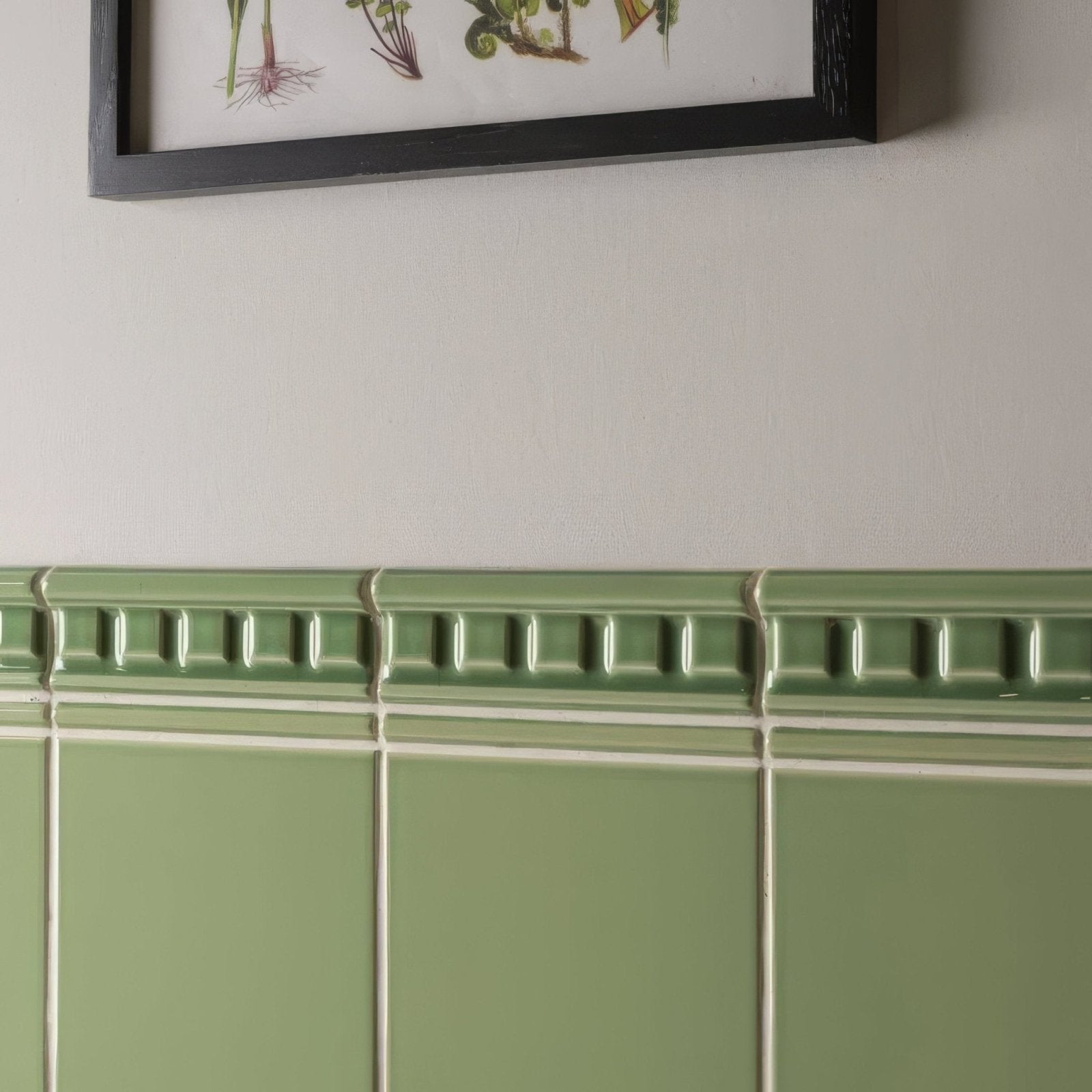 Olive green ceramic tile wainscoting with raised rectangular detailing from palm green omega moulding collection