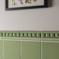 Olive green ceramic tile wainscoting with raised rectangular detailing from palm green omega moulding collection