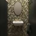 White ceramic wall-mounted sink with gold-toned faucets from palm house ivy single tile collection