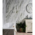Palm Springs Porcelain Cerulean Plain white marble-effect tiles with a freestanding bathtub