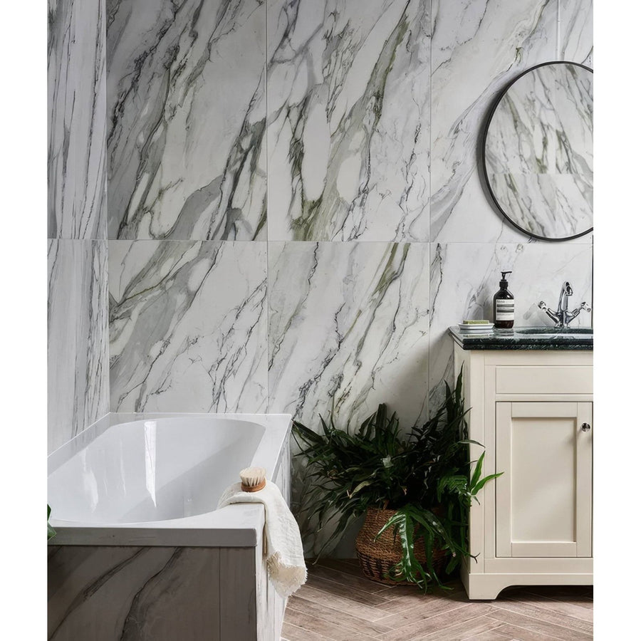 Palm Springs Porcelain Cerulean Plain white marble-effect tiles with a freestanding bathtub