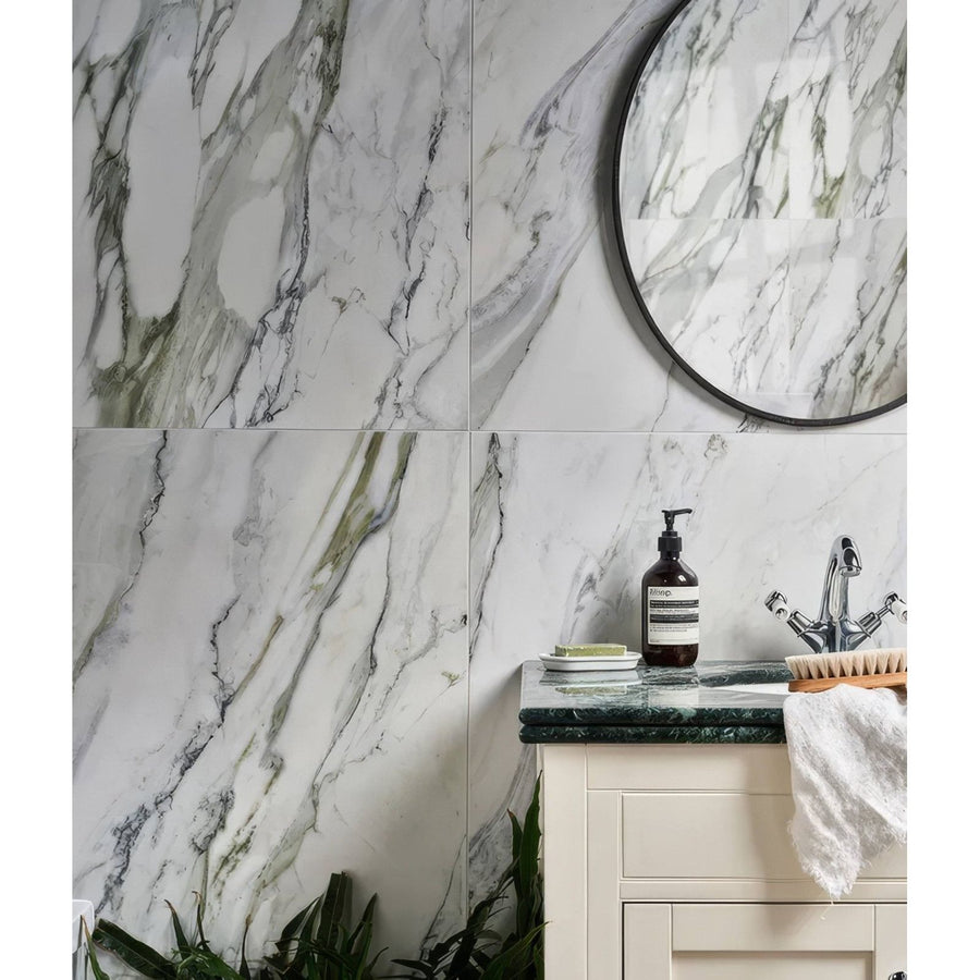 Palm Springs Porcelain Cerulean Plain white marble-effect tiles with an amber glass bottle