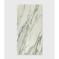 A rectangular slab of palm springs porcelain cerulean plain white marble with elegant green and gray veining