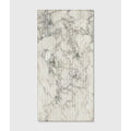 A rectangular palm springs porcelain italiana fluted panel with white and gray marble pattern on vertical corrugated ridges