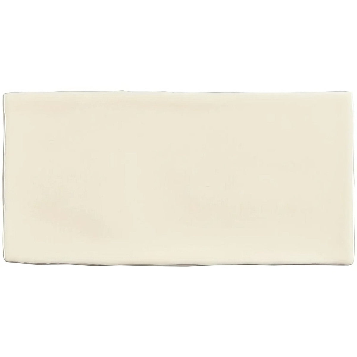 Cream-colored rectangular ceramic palomino brick tile with smooth slightly glossy surface for wall and floor use