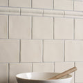 Cream-colored square ceramic palomino field tiles with glossy finish for modern kitchen backsplash