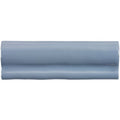 A sleek glossy light blue ceramic pansy torus moulding tile with a smooth curved rectangular shape