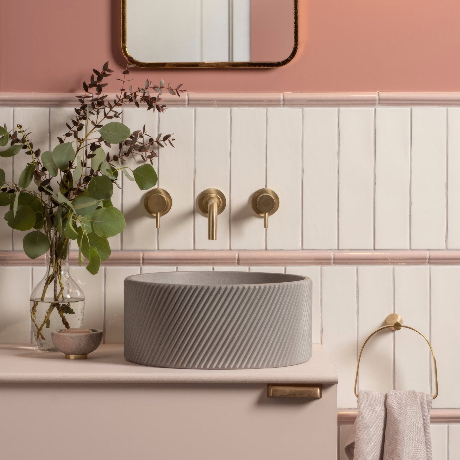 Gray concrete vessel sink with diagonal ribbed texture in papyrus large brick tile design