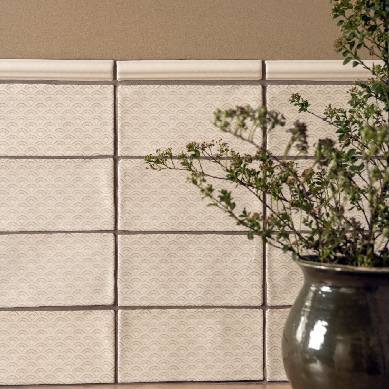 Beige ceramic tiles with a subtle wave pattern arranged in a grid for papyrus ogee moulding design