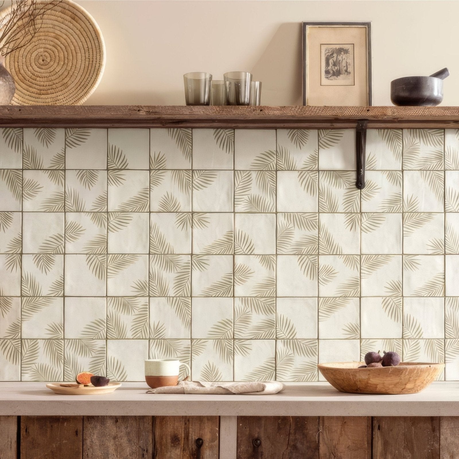 Beige ceramic Paradis Mere 1 tiles with olive-green palm leaf patterns used as kitchen backsplash