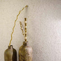 Paradise Tiny Broken Edge Blanco Mosaic white stone mosaic with two bronze vases of dried branches