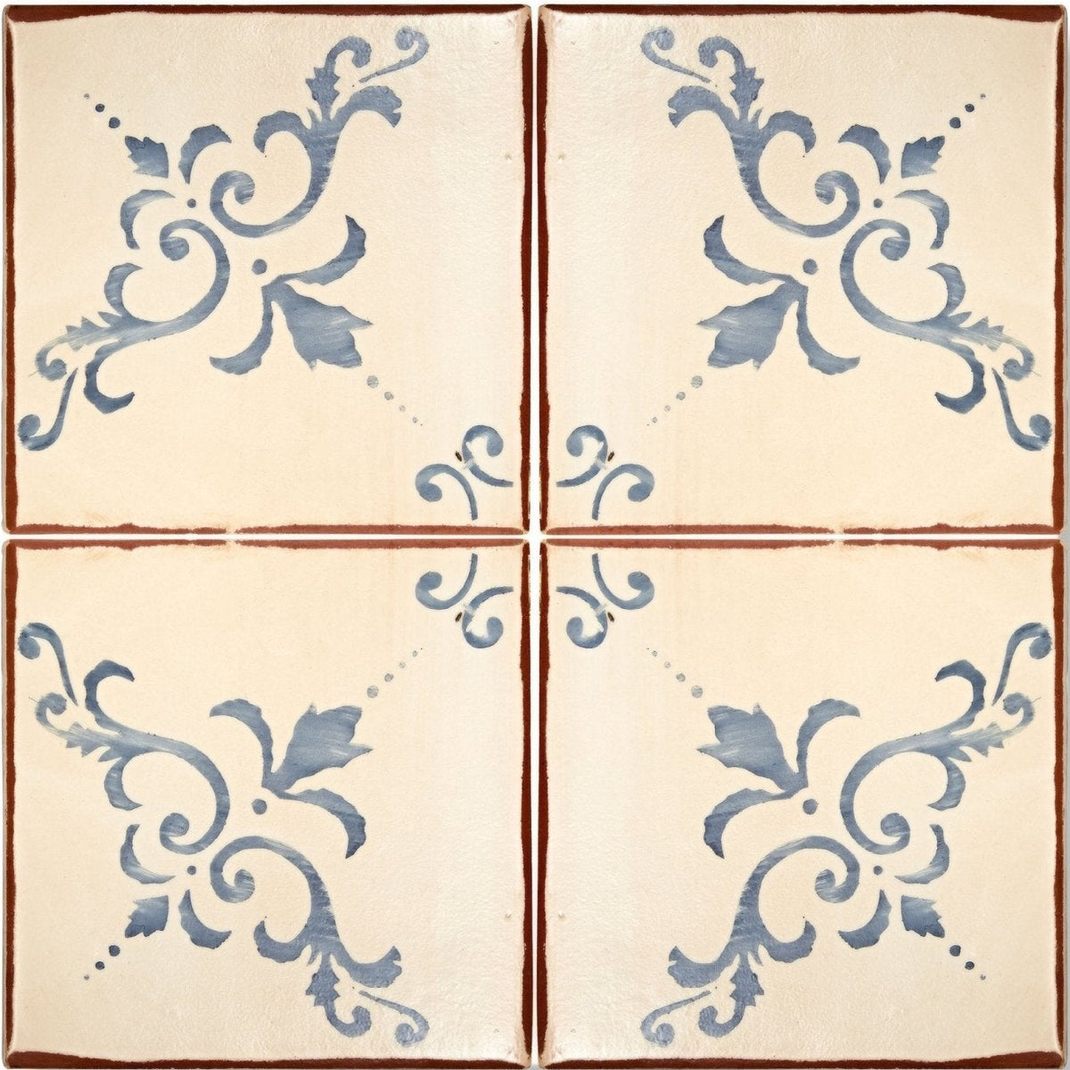 Cream-colored ceramic Paris Isabelle terracotta tile with blue ornate floral patterns and rustic brown border