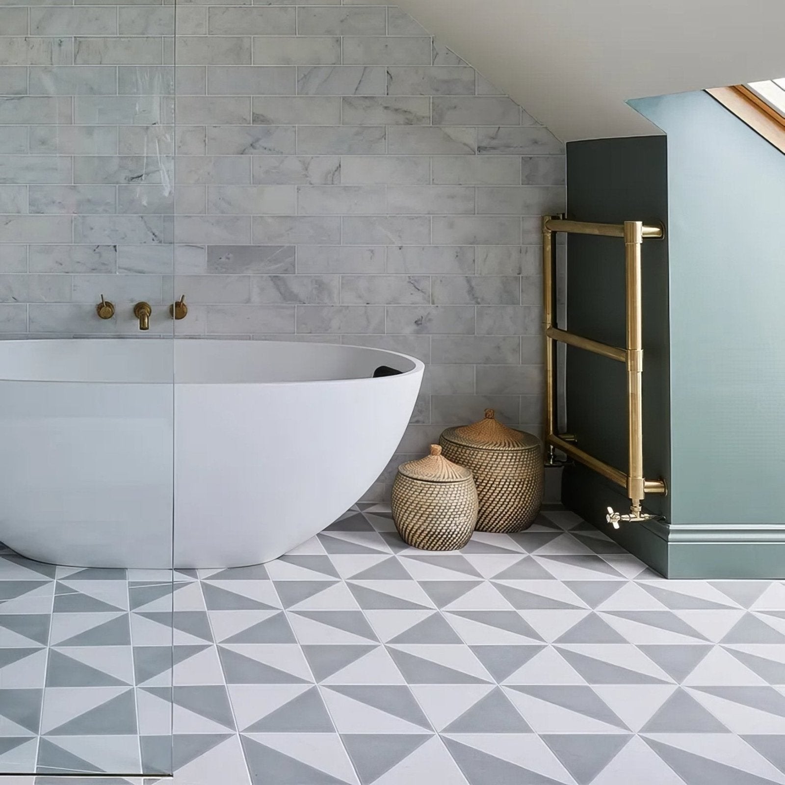 White freestanding porcelain bathtub with smooth rounded edges in minimalist parisian café porcelain tri dove grey design