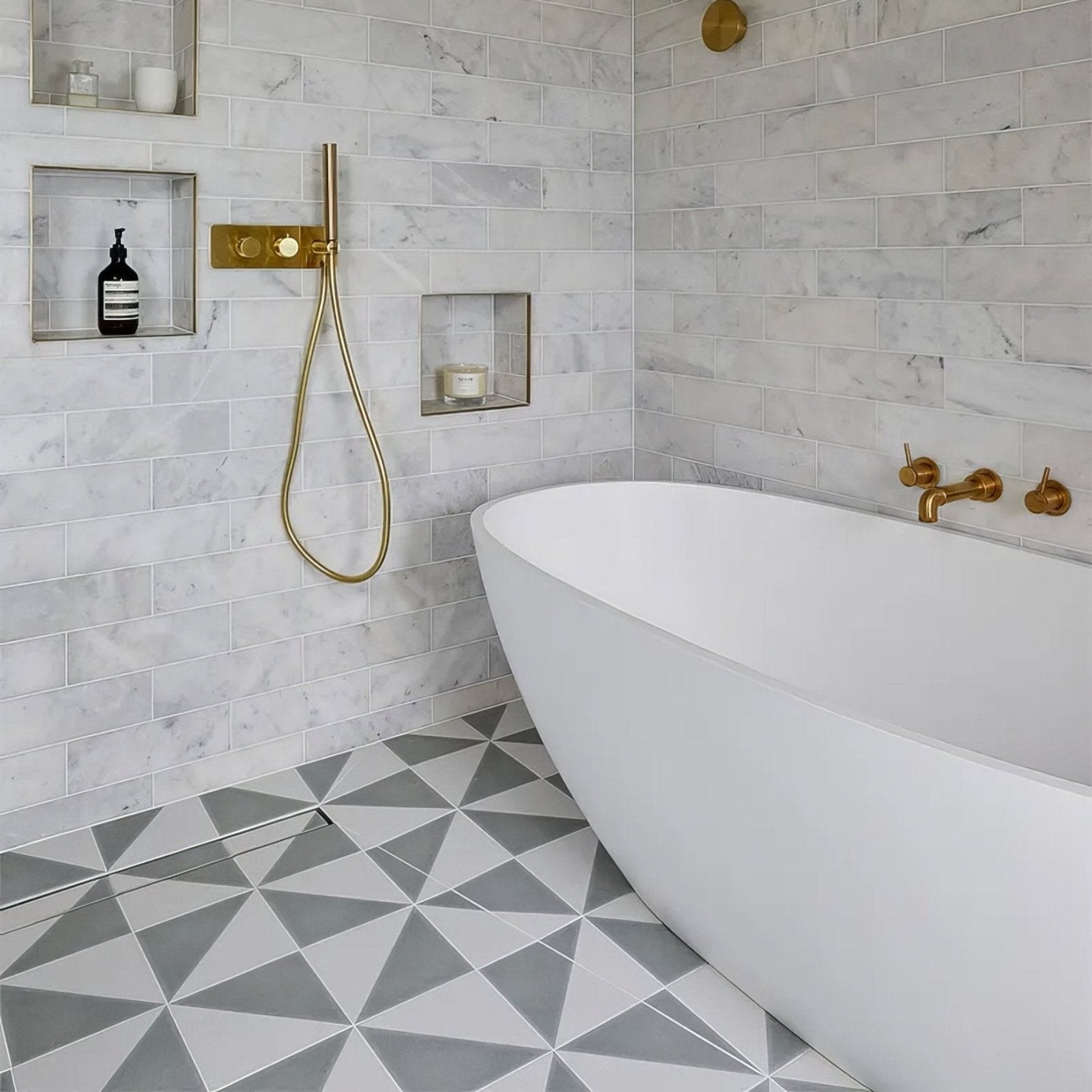 White freestanding porcelain bathtub with sleek modern curves in parisian café porcelain tri dove grey finish