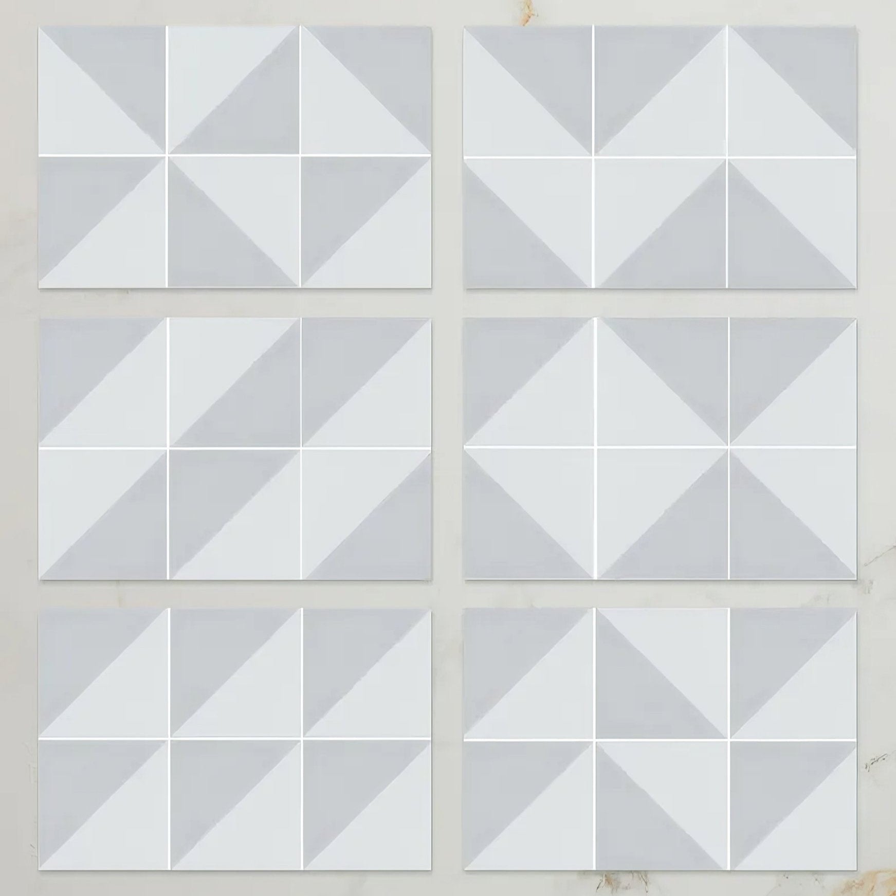 White porcelain geometric accent tiles with modern three dimensional diamond pattern in dove grey parisian café design