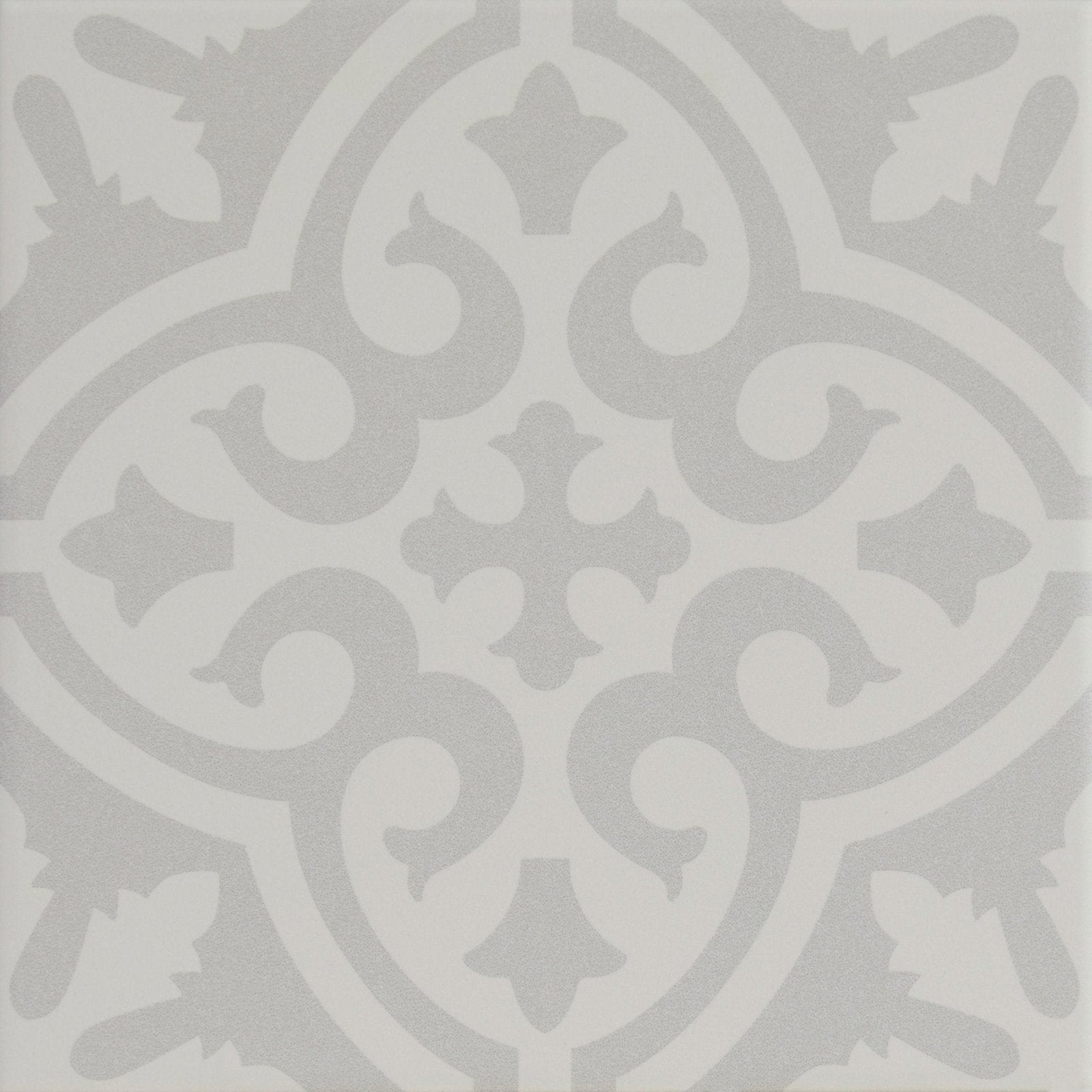 Gray ornamental tile with symmetrical vintage-inspired swirling vines and leaf motifs from Parisian Chic porcelain Angelina collection