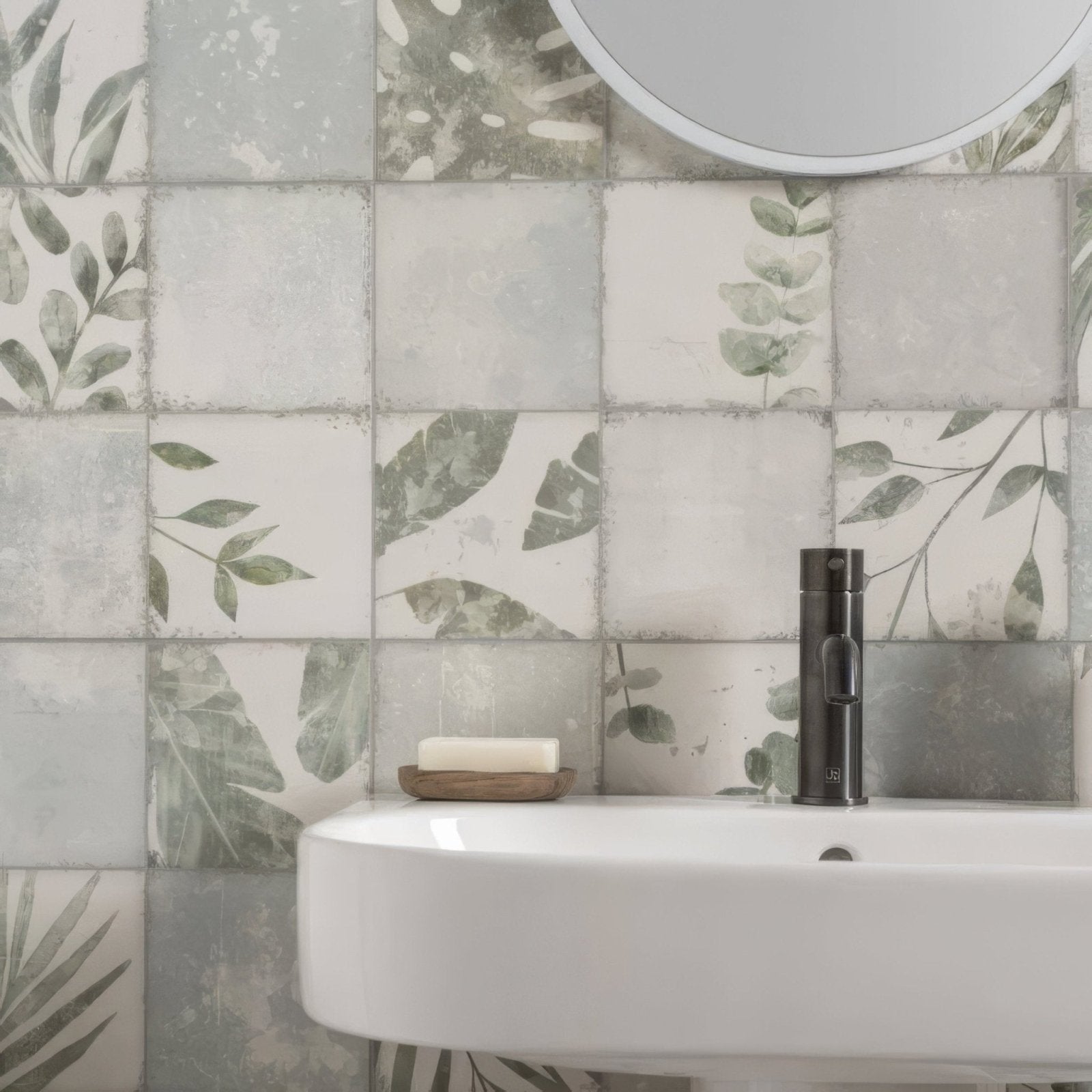 White ceramic sink with a sleek modern design and matte black faucet for the patchwork botanical iris 60x30cm product