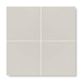 Four square matte-finish beige patisserie blanco porcelain base tiles arranged in a grid pattern